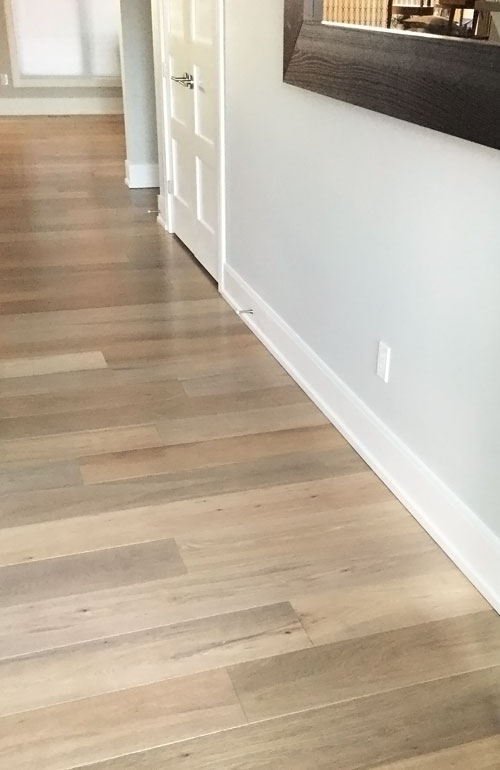 Rafraîchissement de planchers de bois préhuilés